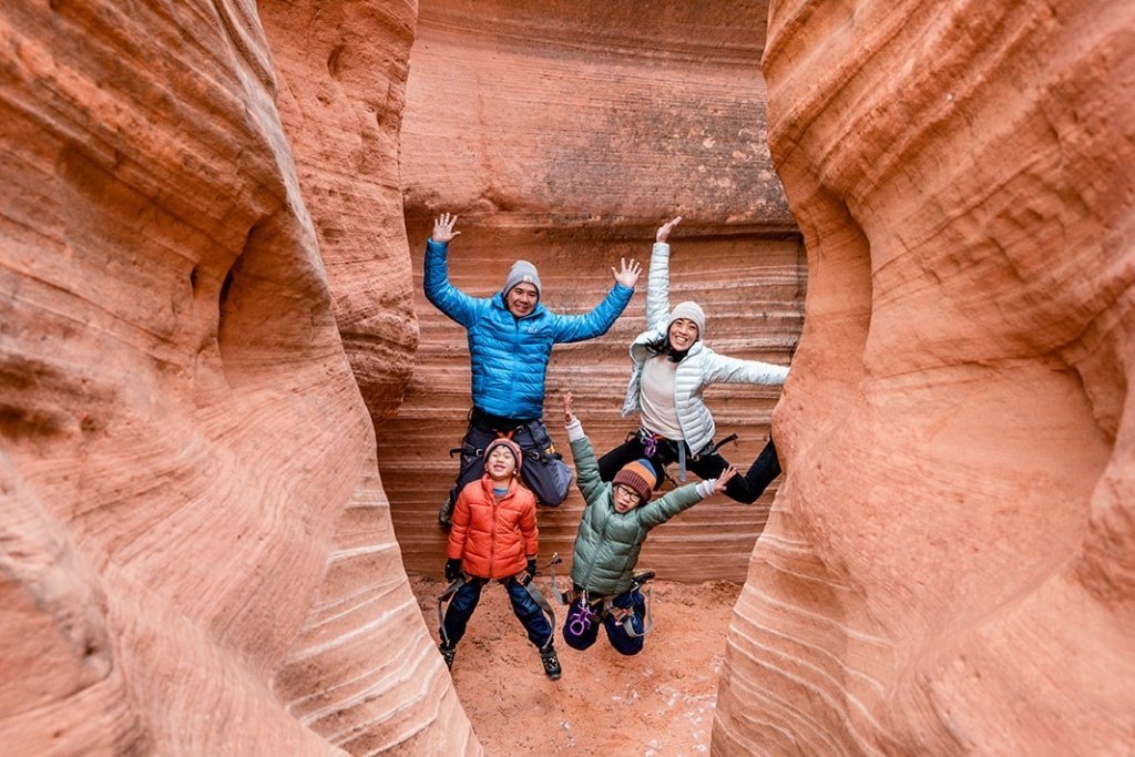 Family celebrating an amazing day hiking slot canyons near Zion with kids