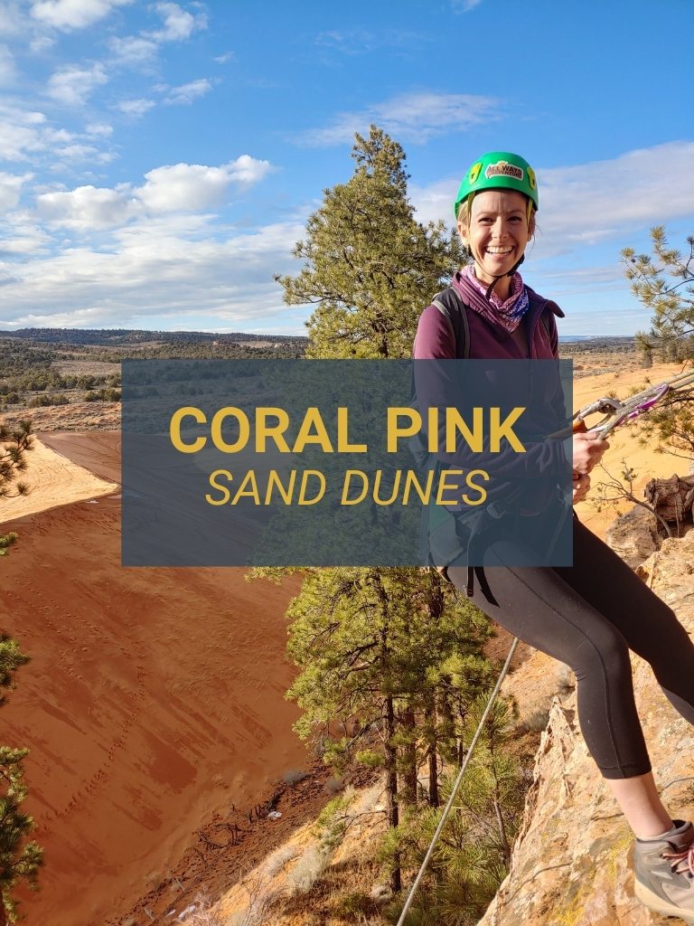 Woman rappelling at Coral Pink Sand Dunes on an All Ways Adventure trip